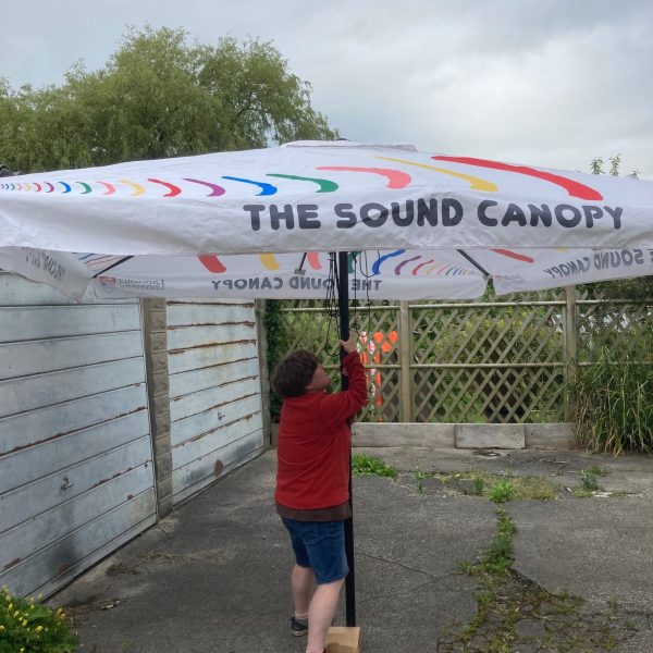 Liz steadies the Sound Canopy parasol against west coast winds